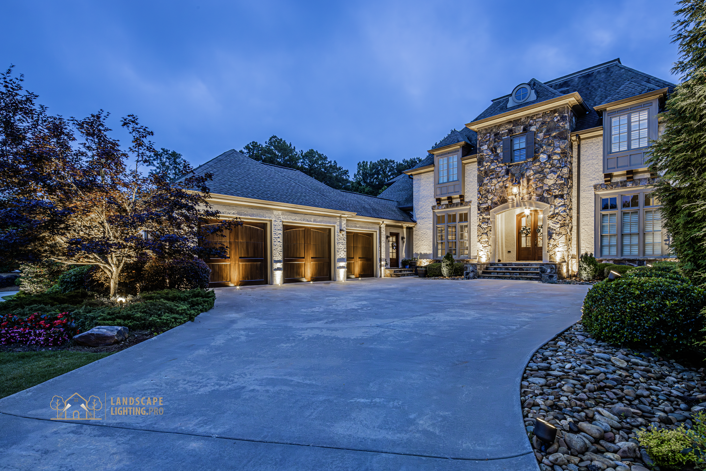 Soft uplight grazing a stone façade at dusk, revealing texture and architectural detail