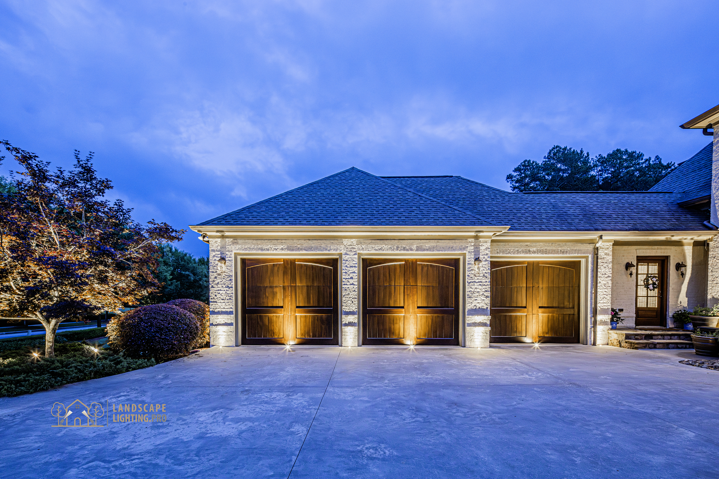 A finished lighting design illuminating a distinguished home at dusk