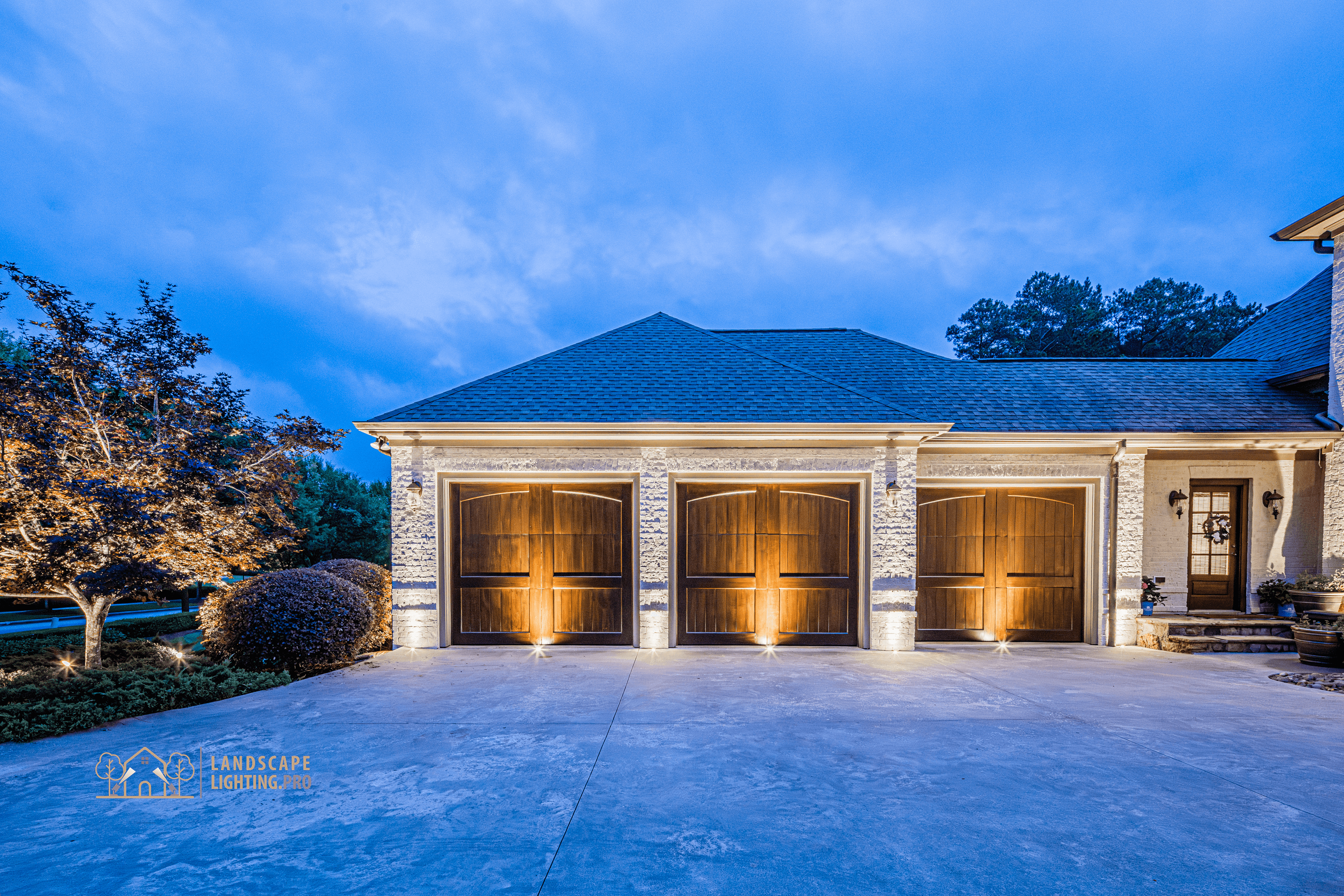 A finished lighting design illuminating a distinguished home at dusk