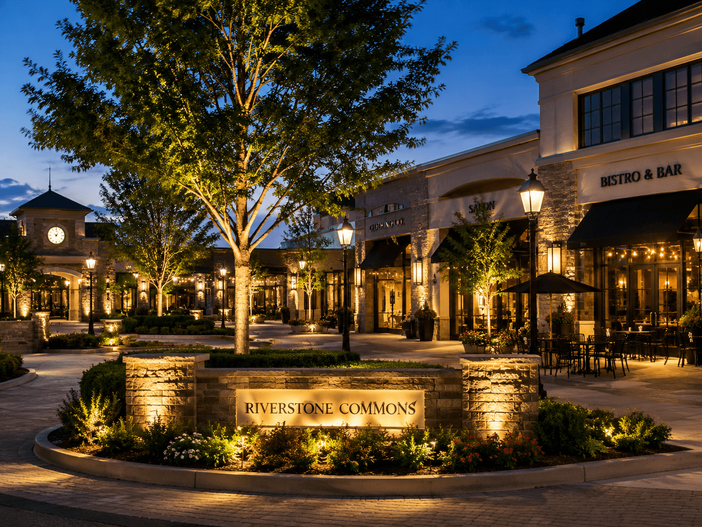 An illuminated restaurant or retail facade at night with restrained accent lighting