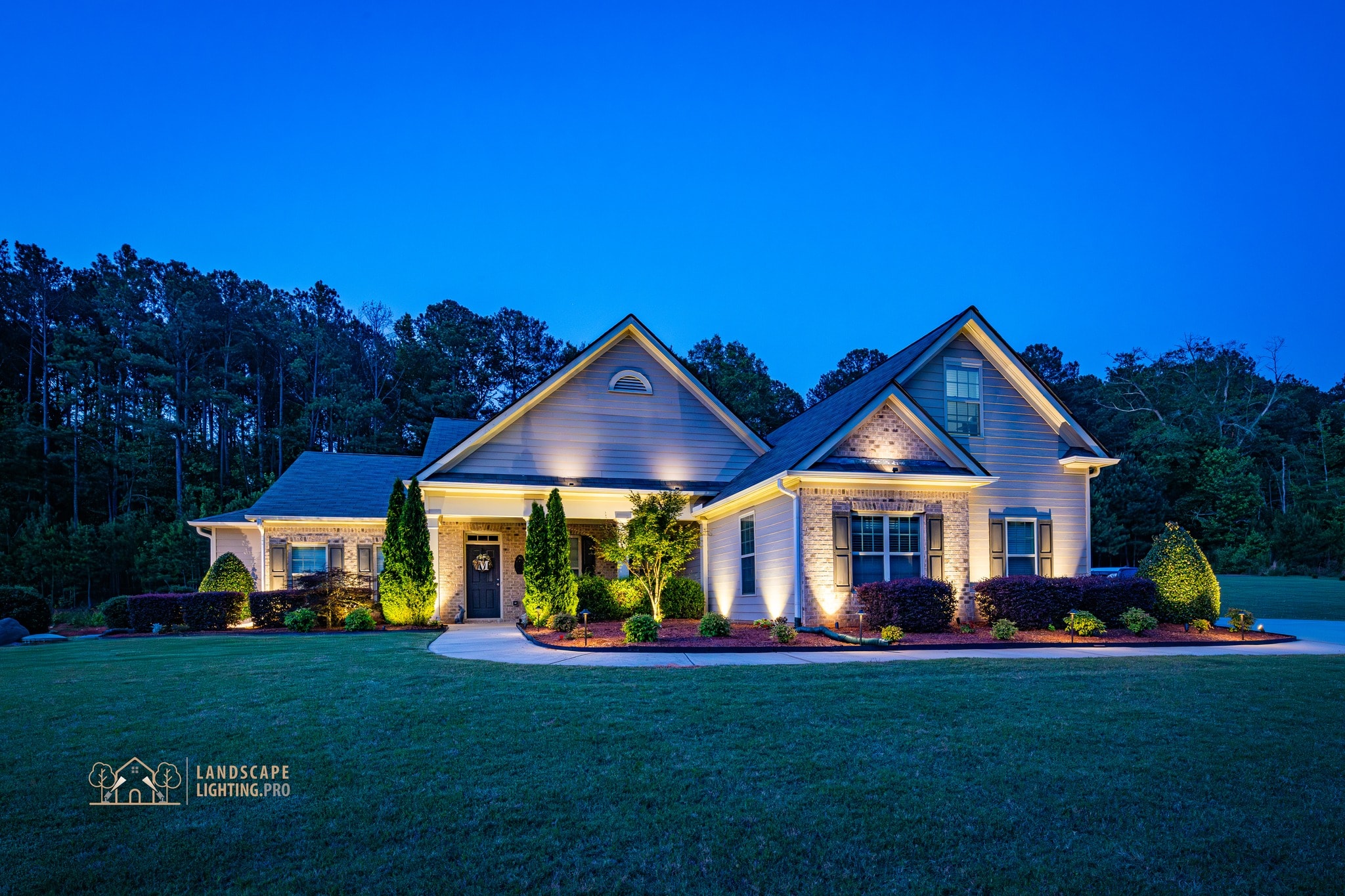 A signature property at dusk, the kind of full-property composition delivered at the Signature tier