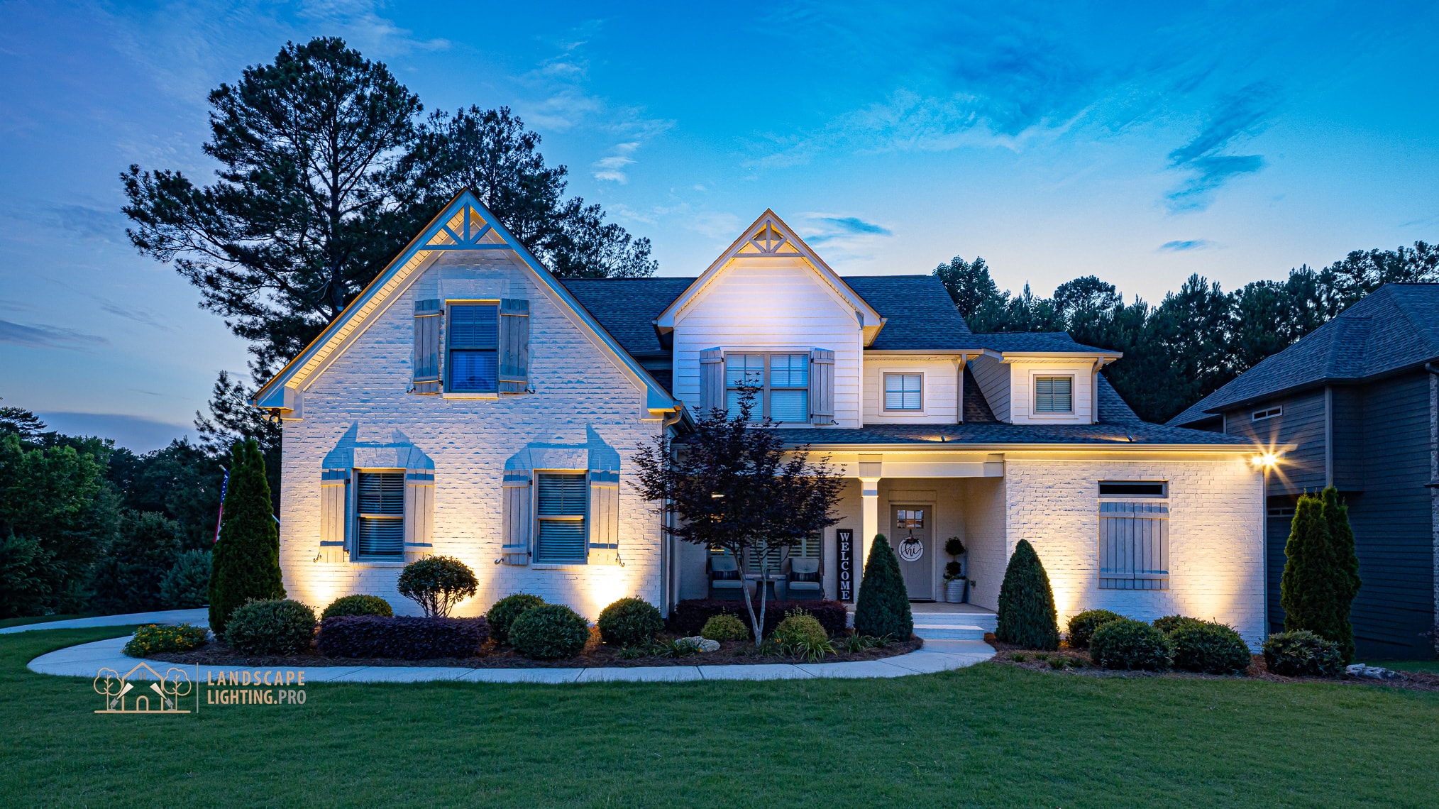 Morningside home with warm architectural lighting after dark