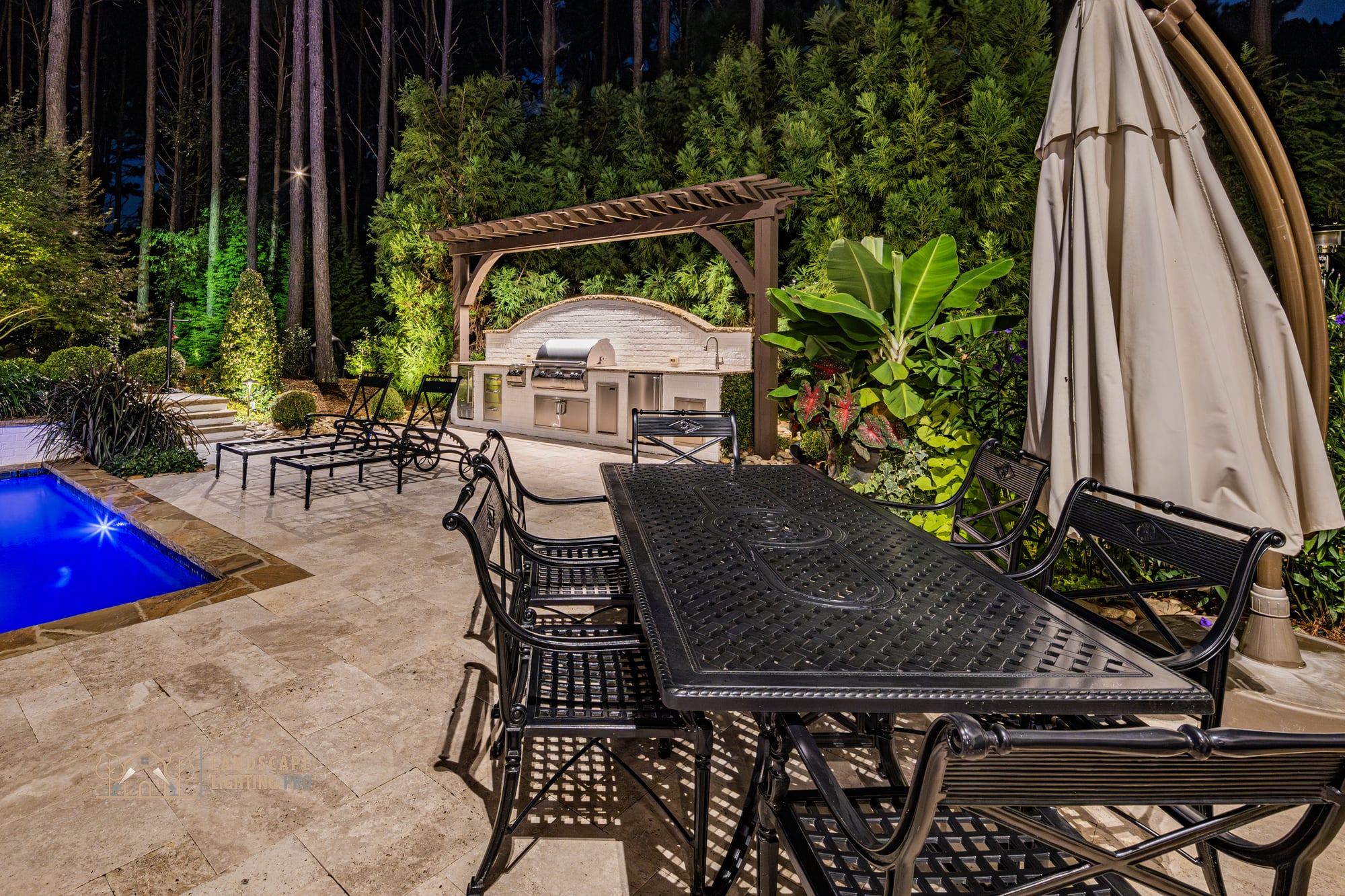 The pool and surrounding patio composition at dusk on the Newhaven property