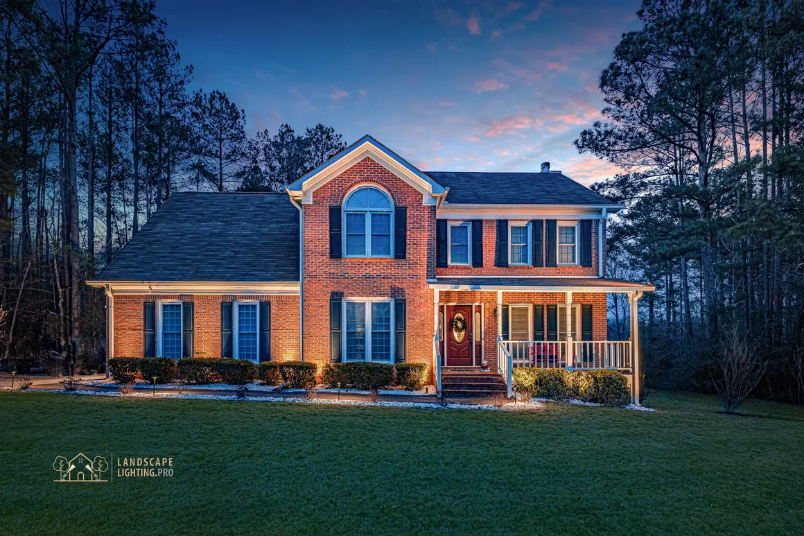 A home illuminated at dusk by the premium starter package
